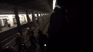 Firefighters Help Stranded Passengers Evacuate Derailed Train in Brooklyn