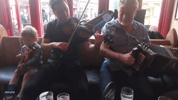 Toddler Hones His Fiddle Skills