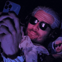 Look At Phone Smiling GIF