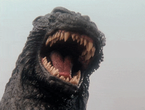 Movie gif. Godzilla from Godzilla vs. King Ghidorah roars loudly into the air. He then looks down, shaking his head. 