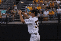 SouthernMissAthletics baseball shoot bow and arrow golden eagles GIF