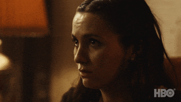 TV gif. Maude Apatow as Lexi Howard in Euphoria dramatically covers her mouth with her hand in shock, her eyes watery.