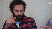 Celebrity gif. Jay Weingarten nods his head up and down, smiling and pointing his finger as if to say, "yessss!" 