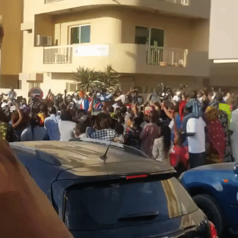 Celebrations in Dakar as the Gambia's New President Adama Barrow Drives By