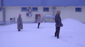 Women Practice Yoga in Snowy Moscow