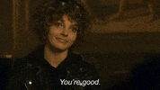 TV gif. Camren Bicondova as Selena in Gotham tilts her head to the side and blinks knowingly, smiling slightly, as he says "you're good," which appears as text.