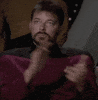 Star Trek gif. Jonathan Frakes as William T. Riker claps heartily, but his face is stoic and expressionless.