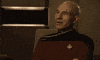 TV gif. Patrick Stewart as Captain Jean-Luc on Star Trek: The Next Generation, Shakes his head and smiles proudly at someone off screen, clapping as he says, "Well done."