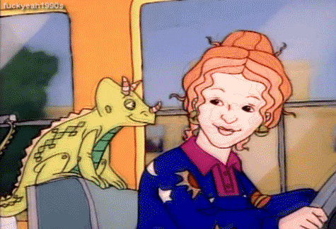 Cartoon gif. Ms. Frizzle from The Magic School Bus drives the bus and looks over her shoulder at Liz the Lizard who is sitting on the back of her seat. They wink at each other like they had something sneaky planned.