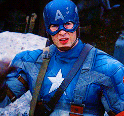 Movie gif. Chris Evans as Captain America looking up and giving a salute.