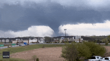Siren Blares as Large Tornado Moves Through Lincoln, Nebraska