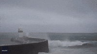 Dramatic Moment Waves Crash Over Lighthouse as Storm Gerrit Rages