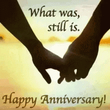 Video gif. A silhouette of two hands delicately holding each other with the sun glistening in the distance. The text says, “what was, still is. Happy Anniversary.” 