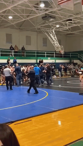 Father Charged With Assault After Tackling Son's Opponent at High School Wrestling Match