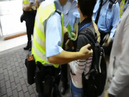 Police Detain Pro-Democracy Activist in Mong Kok
