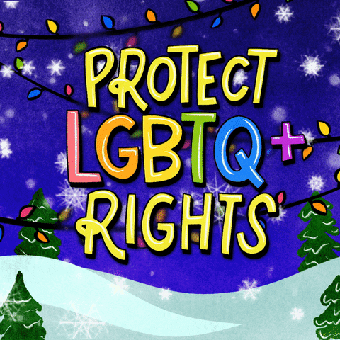 Text gif. Shiny canary yellow and rainbow bubble letters in front of a snowy scene with colorful Christmas lights. Text, "Protect LGBTQ+ rights."