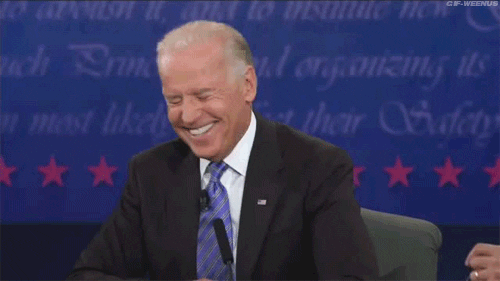 Political gif. Joe Biden sits in a chair during a presidential debate. He shakes his head while laughing. He’s laughing so hard he has his eyes closed and he’s smiling from ear to ear.