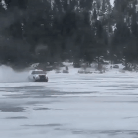 Police Officers Drive Patrol Cars on Frozen Lake