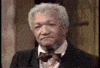 TV gif. Red Foxx as Fred Sanford in Sanford & Son shakes his head in disapproval, then looks to man on his right, who looks to a man on his right, who looks to a man on his right, who settles into a groan of mild despair.