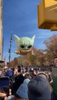 Baby Yoda Balloon Floats Above Crowds at the Macy’s Thanksgiving Parade