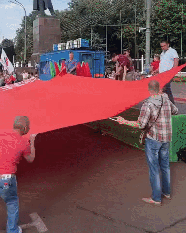 Lukashenko Supporters Unfurl Giant Belarus Flag During Rally in Gomel