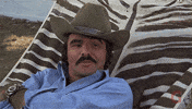 burt reynolds laughing GIF