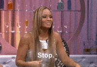 Reality TV gif. Evelyn Lozada on Basketball Wives tilts her head to the side and flashes her hands in front of her as she says, "stop," which appears as text.