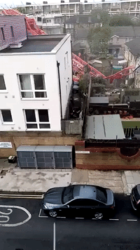 Crane Collapses on Homes in East London, Causes Injuries