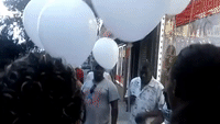 Protesters Release Balloons To Mark Third Anniversary of Eric Garner's Death