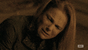 TV gif. Tovah Feldshuh as Deanna in The Walking Dead appears tearful as she looks up from the ground and says "do it." Scene cuts to a man whose face is covered in blood who turns away, and then to Andrew Lincoln as Rick who shoots his gun.
