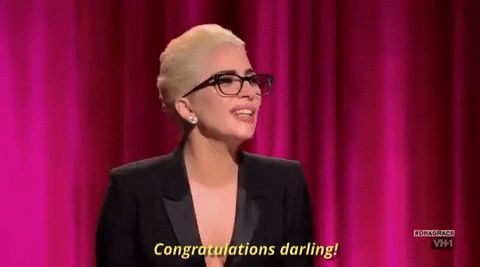 Reality TV gif. Lady Gaga on RuPaul's Drag Race. She juts a chin out proudly as she says, "Congratulations darling!"