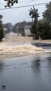 Water Gushes Down Street After Water Main Break in Upstate New York