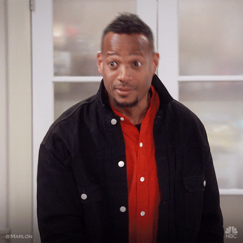 TV gif. Marlon Wayans in Marlon leans back, purses his lips, and raises his eyebrows, giving us a sassy, "I told you so" look.