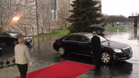 Theresa May Arrives for Meeting With Angela Merkel, Gets Locked in Car