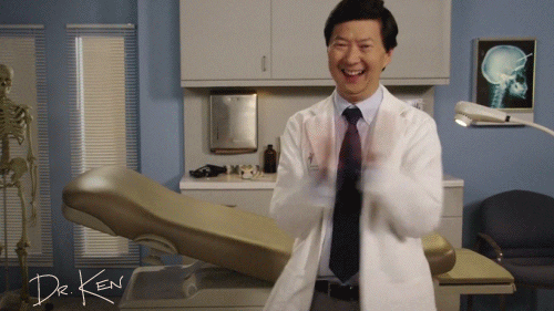 TV gif. Ken Jeong as Ken on Dr. Ken stands in an exam room smiling and clapping enthusiastically. 