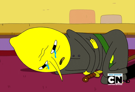 Cartoon gif. Earl of Lemongrab from Adventure Time lies in the fetal position on the floor, holding himself and weeping.