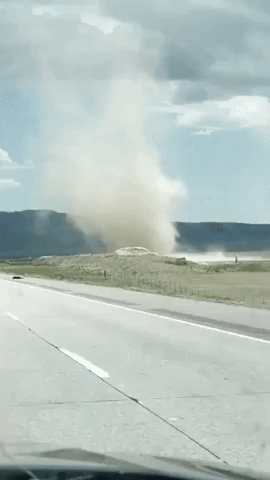 Dust Devil Sends Tumbleweeds Across Idaho Highway