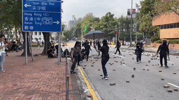 Protesters Outside Hong Kong Polytechnic University Lay Brick Roadblocks