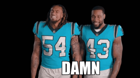 Sports gif. Shaq Thompson and Haason Reddick from the Carolina Panthers are in their football uniforms and they both dramatically turn to the left, reacting at something with interest and saying, "DAMN."