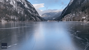 Canadian Man Travels Mary Poppins-Style Across Frozen Lake With Umbrella Sail