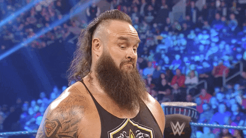 Sports gif. WWE star Braun Stroman shrugs his shoulders and nods in agreement in the ring.