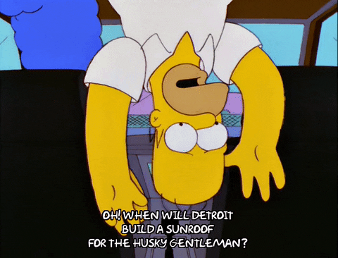 The Simpsons gif. Homer hangs upside down in a car, stuck, saying, "oh, when will Detroit build a sunroof for the husky gentleman?"