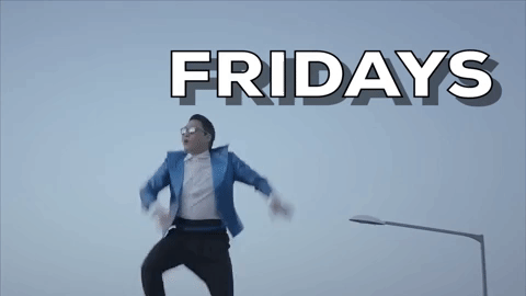 Video gif. A low-angle shot of Psy doing a hopping dance in a shiny blue jacket under a cloudy sky. Text, "Friday."
