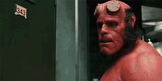 Movie gif. Ron Perlman as Hellboy points straight at us. His finger appears to be very close. Sternly, he says: Text, "Stop it. Right now."