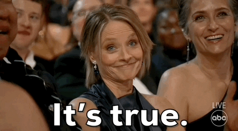 Oscars 2024 GIF. Jodie Foster, seated at the Oscars, nods in emphatic admission, reiterating, “It’s true.”