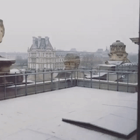 Snow Falls at Louvre in Paris as Cold Front Crosses France
