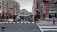 Duo Toss Football in Empty Street Amid Tightened Security Measures in Washington