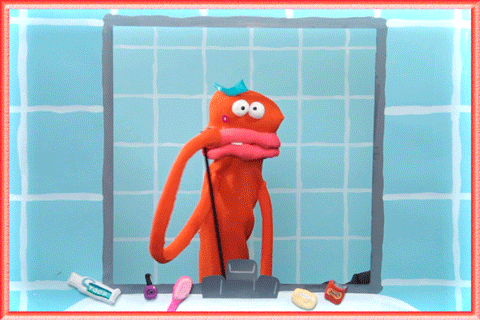 Video gif. An orange puppet looks into a mirror and discovers a pimple, then throws her head back and yells, “why?”