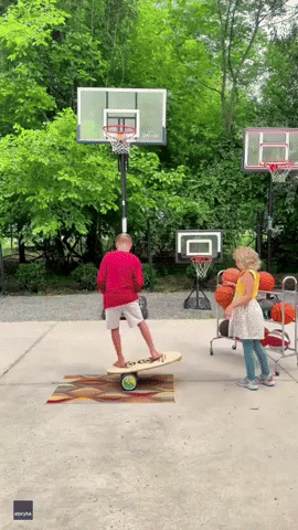 Talented 10-Year-Old Does Trick Shots With Little Sister's Help