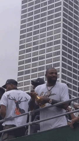 Milwaukee Bucks Player Sprays Champagne on Victory Parade Crowd